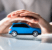 Hands hovering a toy car
